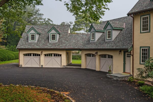 Overlay Carriage House Steel shown in Sandstone with optional Arched Madison Window Inserts.